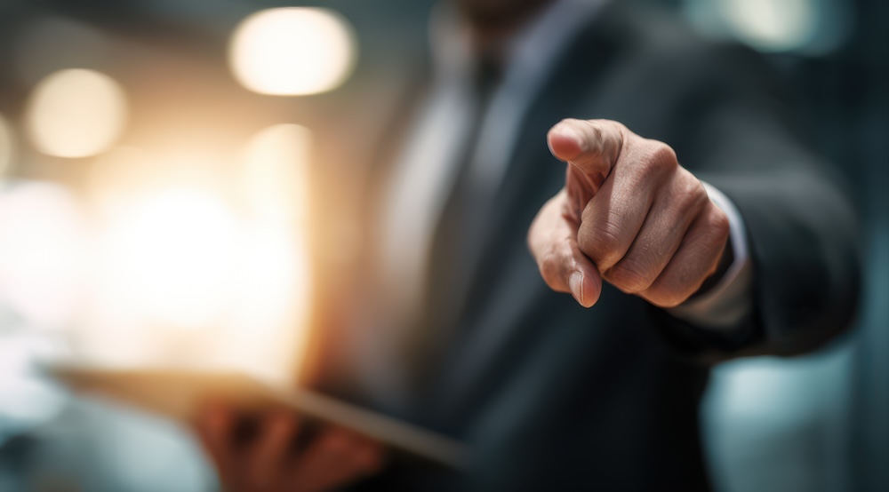 Business professional pointing blame during a technology support problem